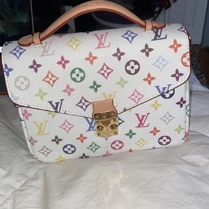 LOUIS VUITTON CROSSBODY ( has scoff on the back as shown in pic)